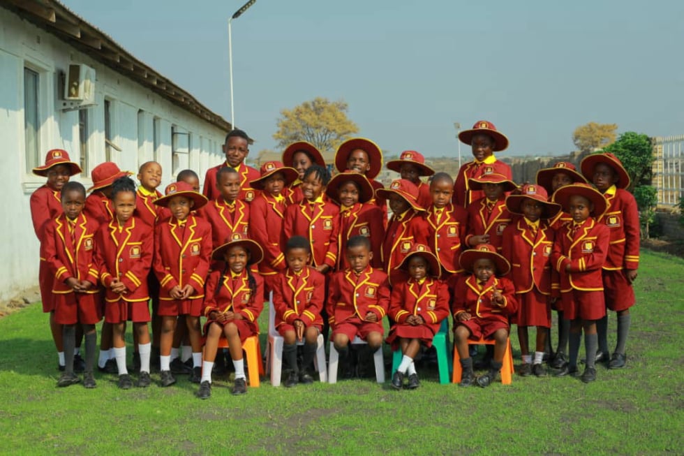 Beverly Hills junior school students in red and gold uniforms